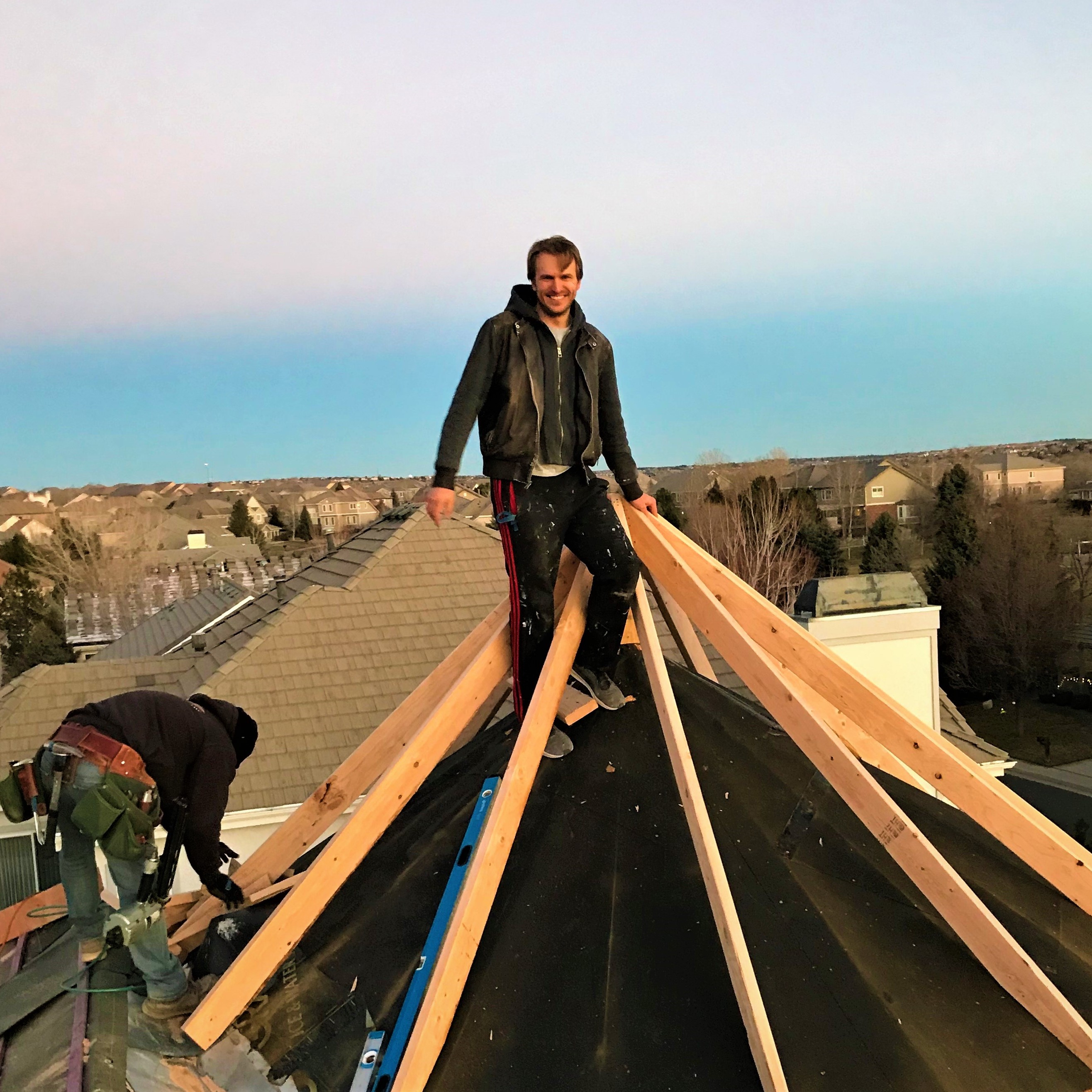 Standing on tope of the roof