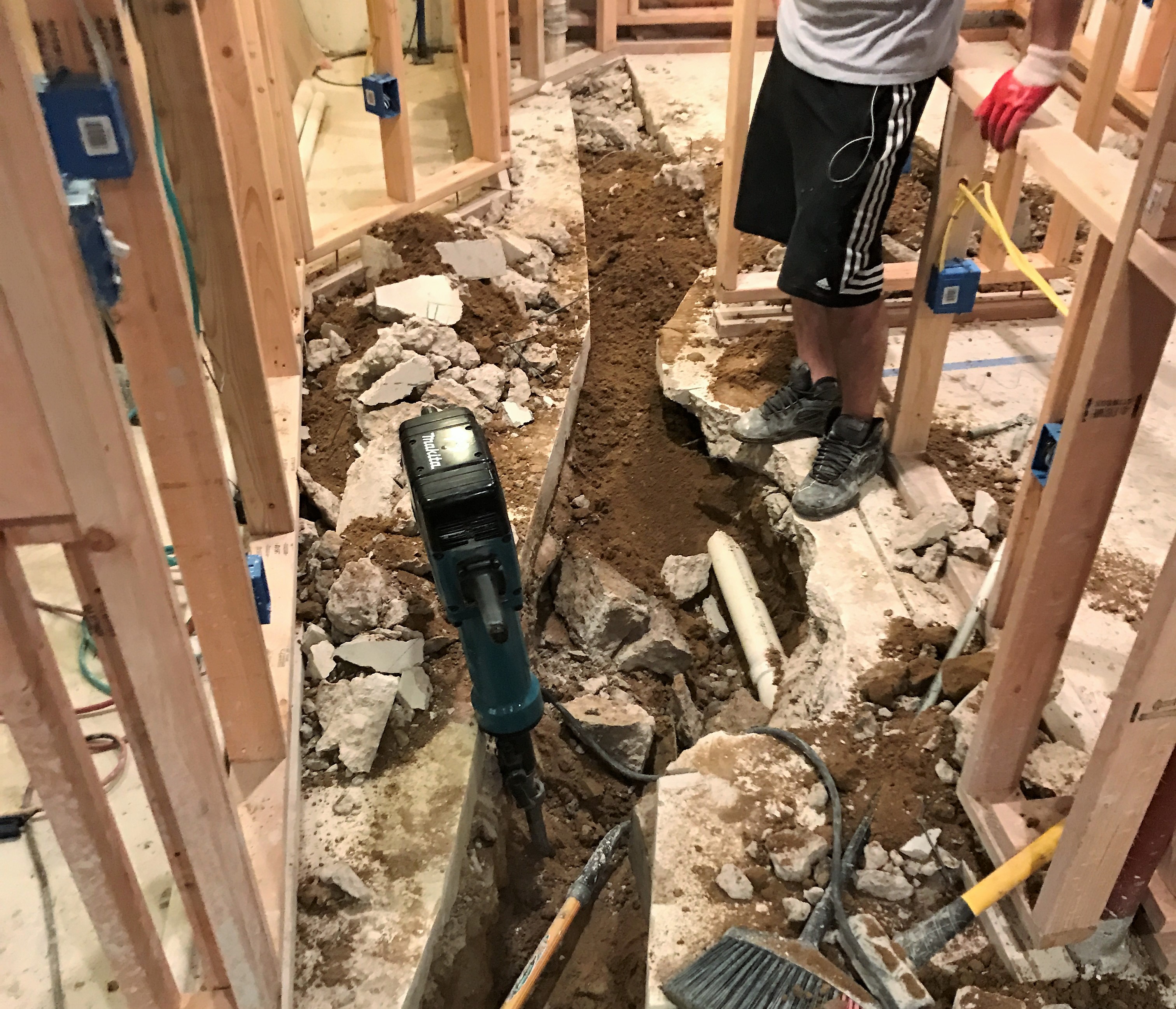 Demolishing the basement concrete floors for plumbing lines
