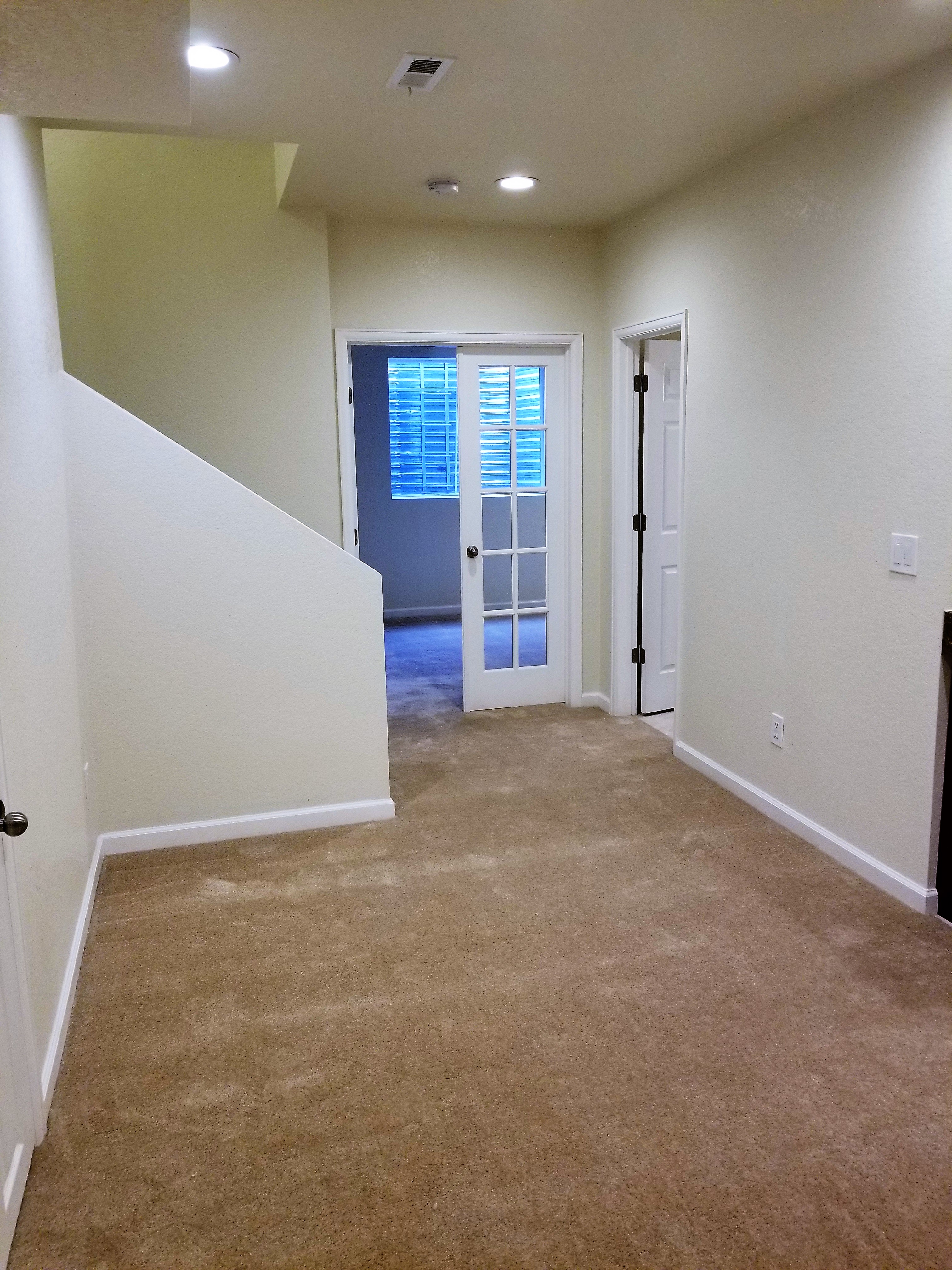 small kitchen cabinet and countertop in a basement