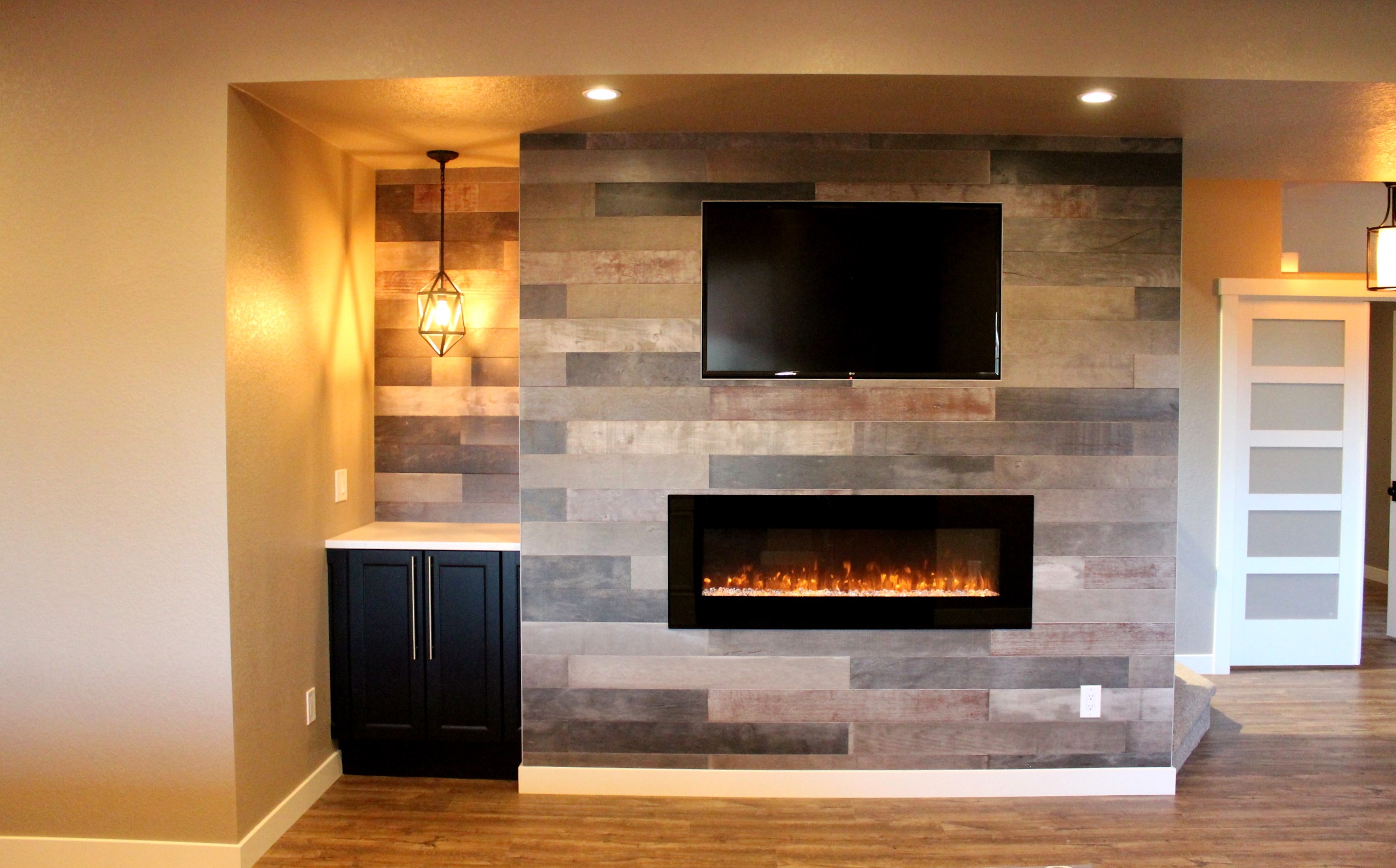 finished basement fireplace with tv above