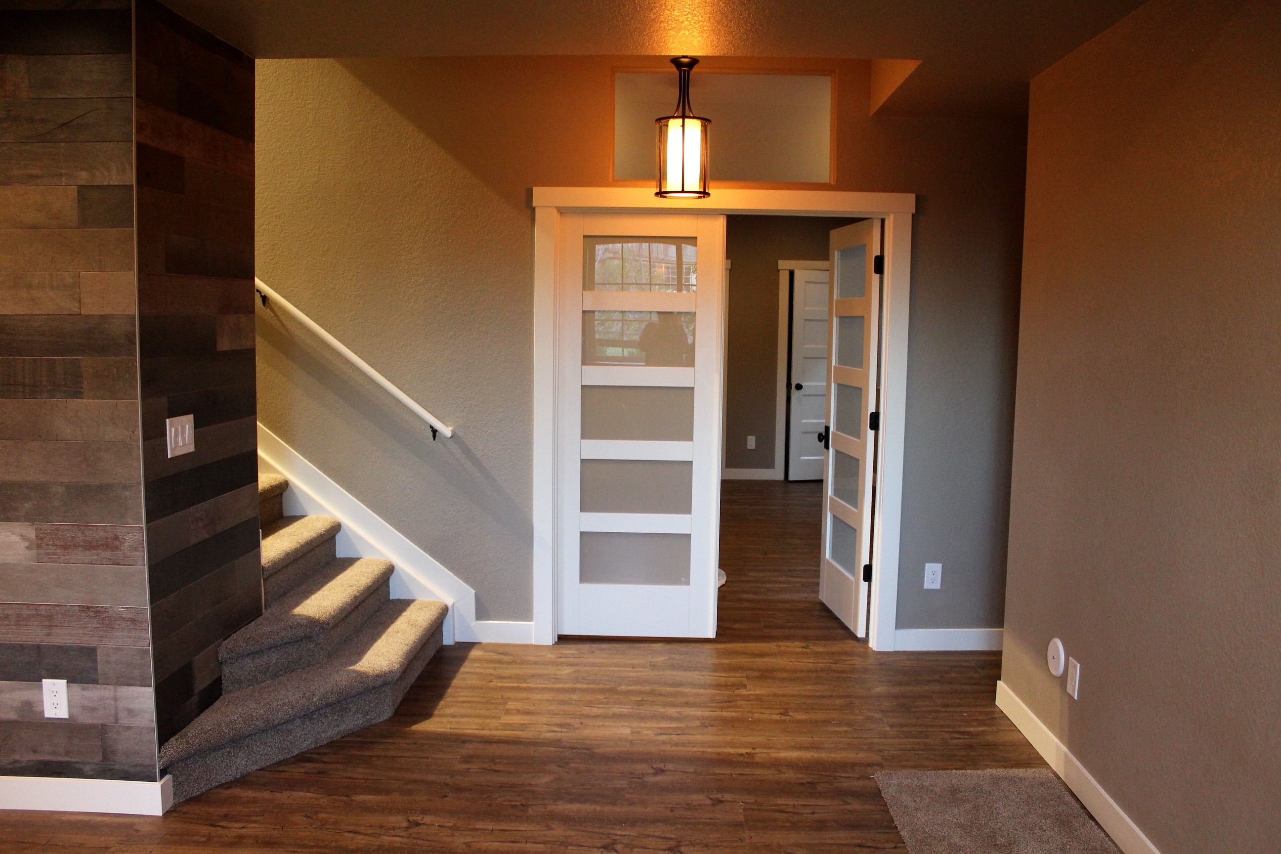 finished basement staircase with french doors