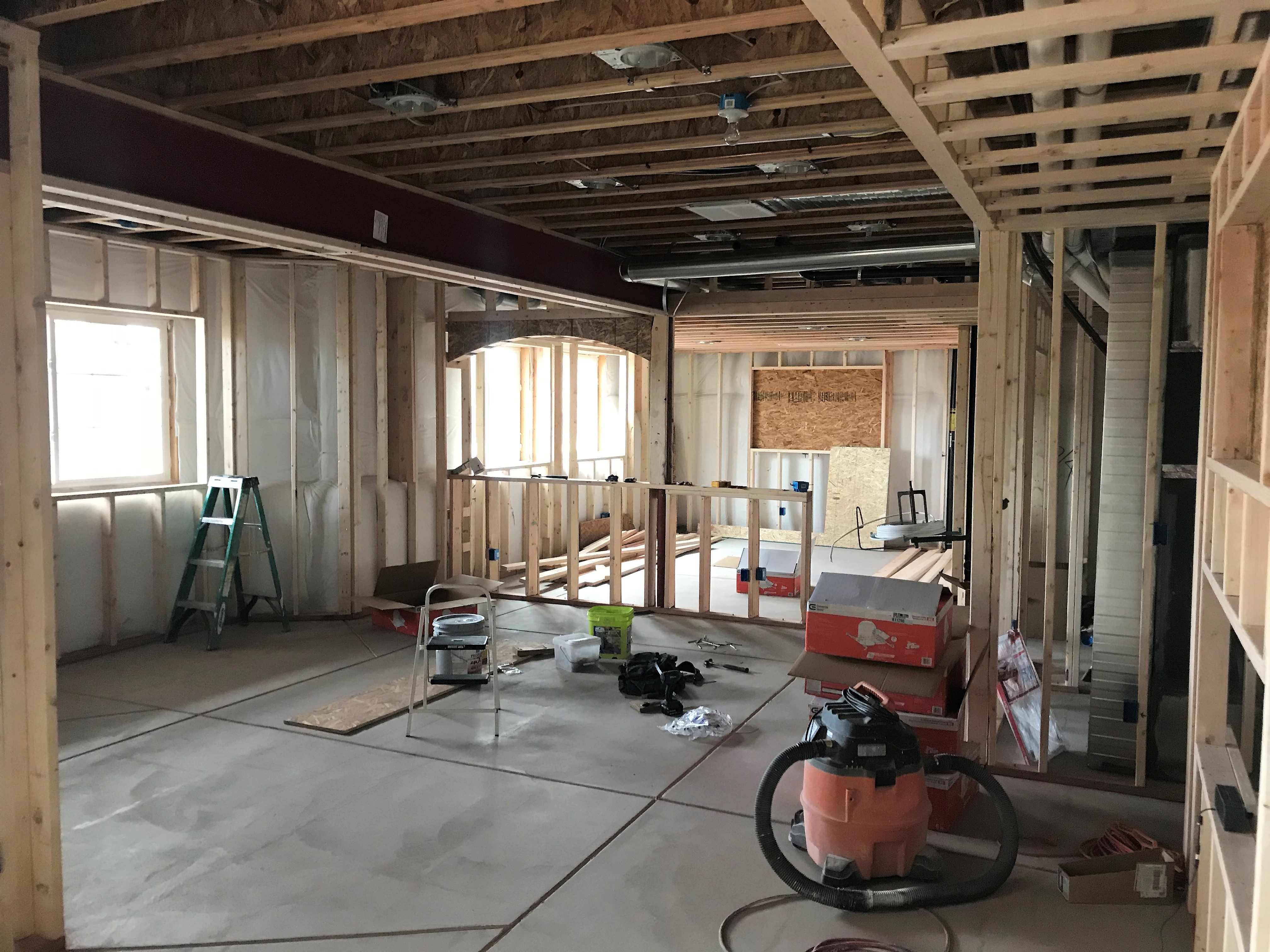 Rough framing of a basement build being completed