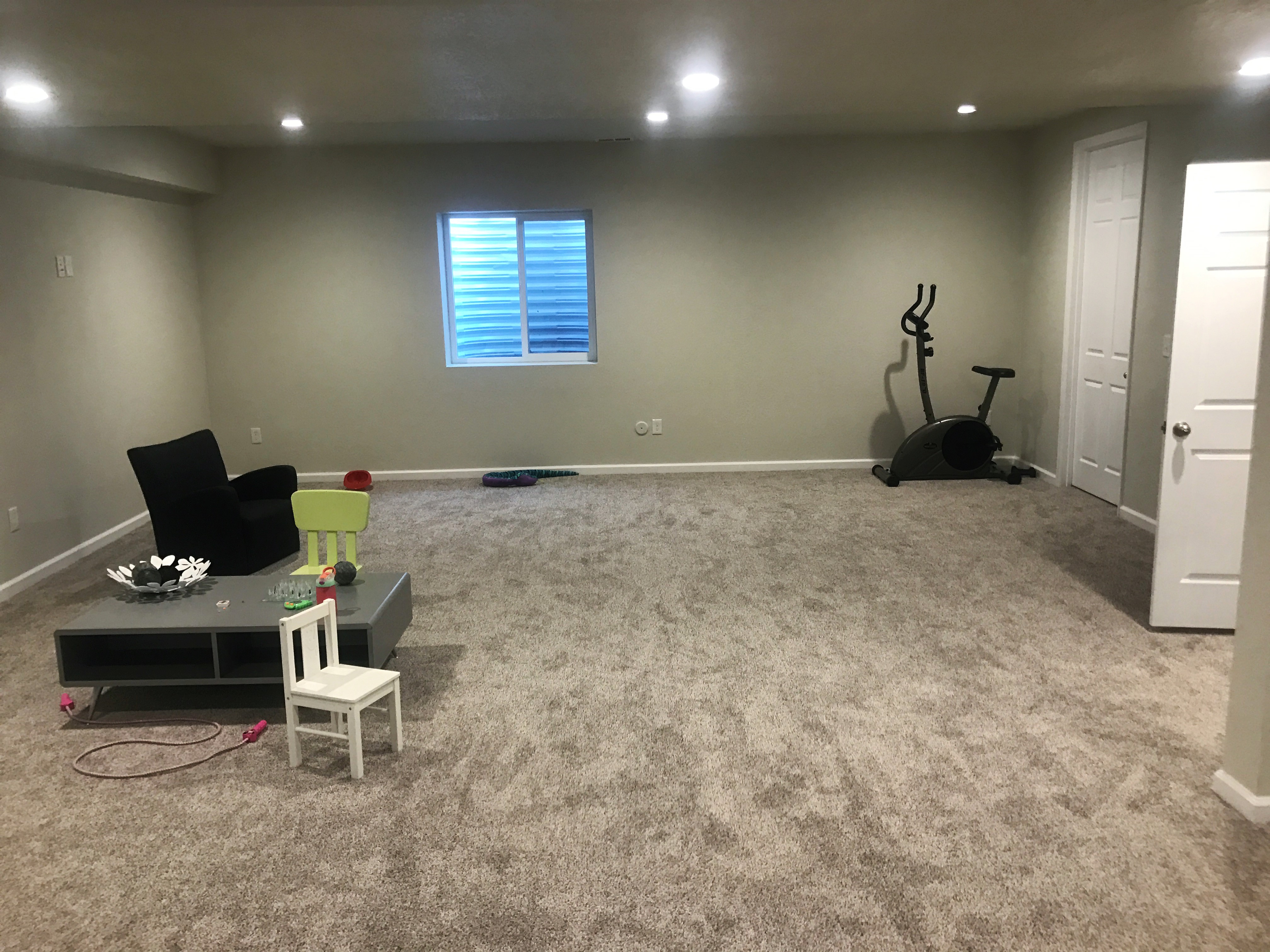 finished basement with little furniture