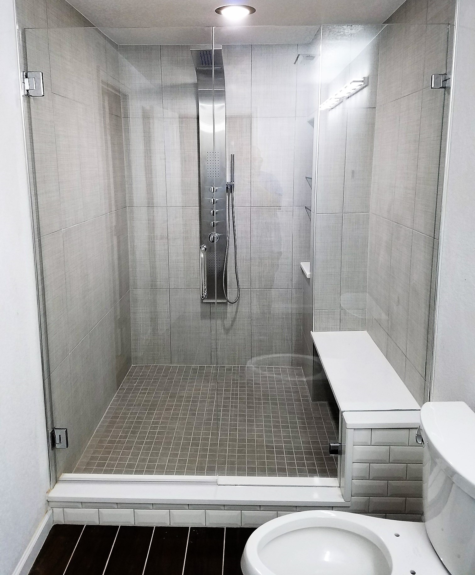 glass shower with a shower tower